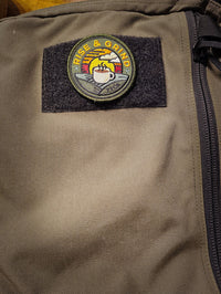 rise and grind patch on backpack