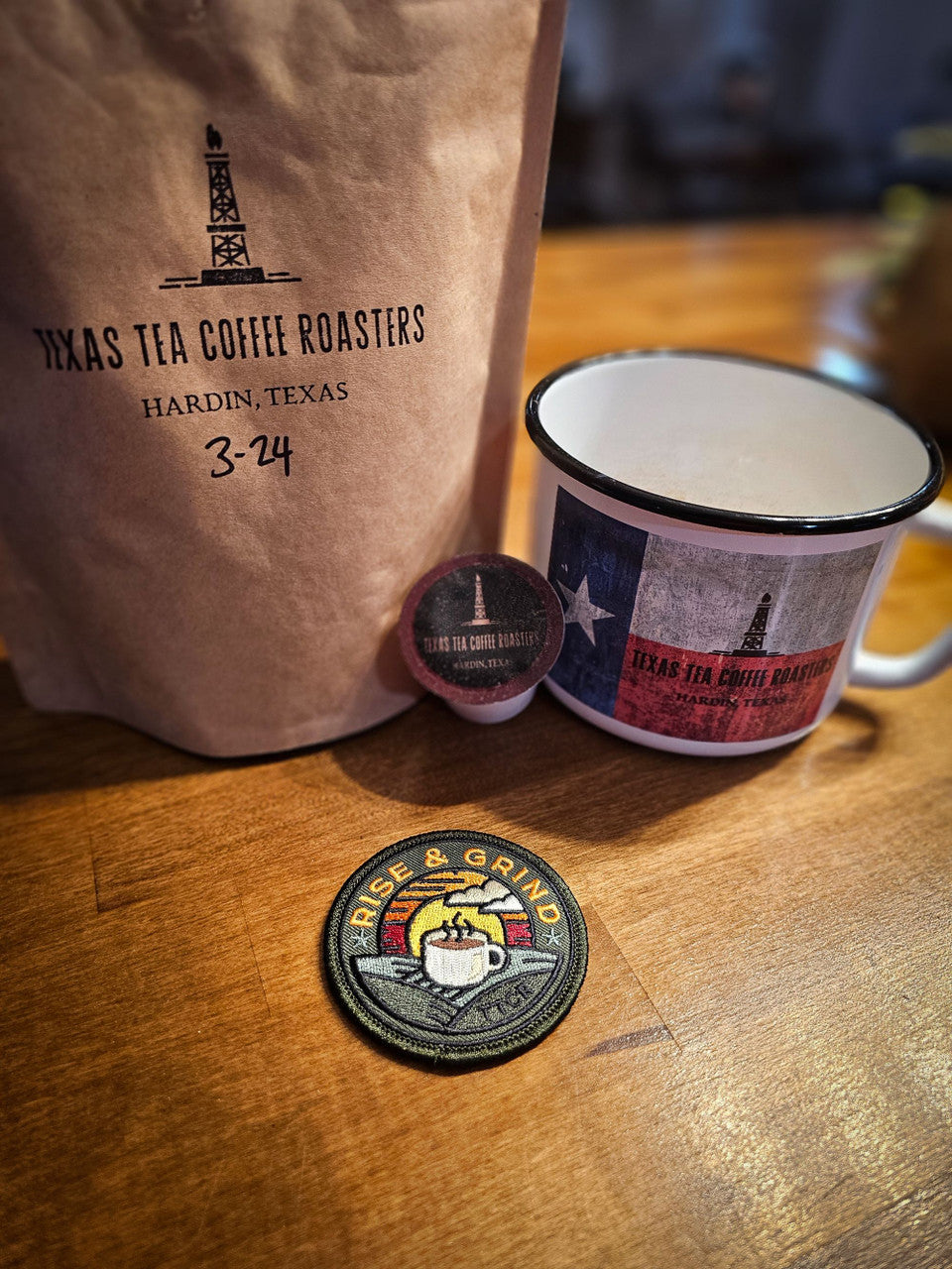 rise and grind patch next to Texas Tea Coffee bag and cup